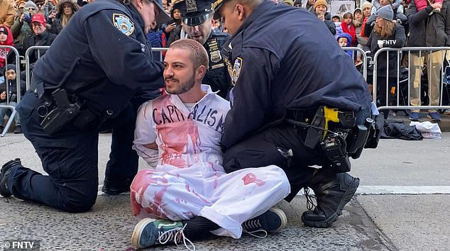 NY cops arrest 34 pro-Palestinian protestors who disrupted Macy’s Thanksgiving Day Parade by gluing themselves to Sixth Avenue and covering themselves in fake blood made from grape juice
